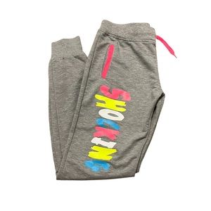 Girls “shocking” slogan joggers